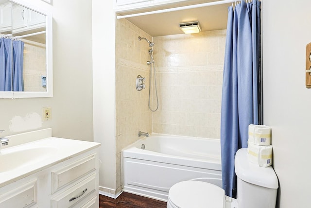 359 Elm St, Elgin, IL 60123 - bathroom featuring toilet, vanity, shower / bath combination with curtain, and wood finished floors