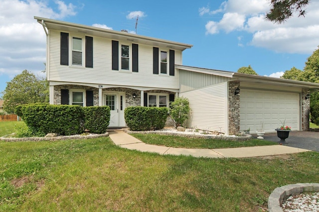 104 S Walnut Ln, Schaumburg, IL 60193 - view of front of property featuring a garage, a front yard, and driveway