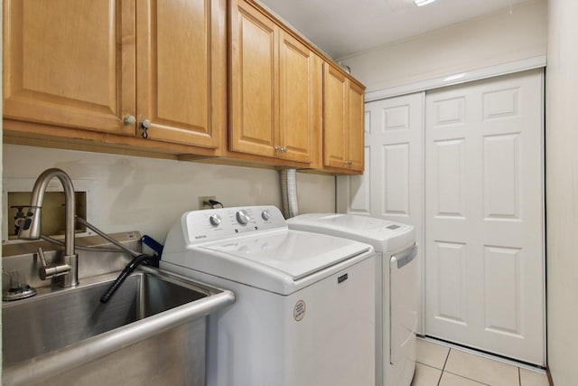 104 S Walnut Ln, Schaumburg, IL 60193 - laundry area with cabinet space, washer and dryer, and light tile patterned floors