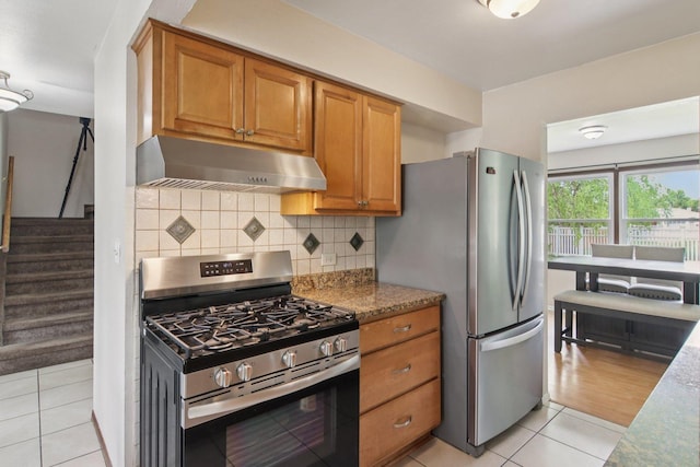 104 S Walnut Ln, Schaumburg, IL 60193 - kitchen with appliances with stainless steel finishes, under cabinet range hood, and brown cabinetry