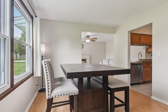 104 S Walnut Ln, Schaumburg, IL 60193 - dining space with a ceiling fan, light wood-type flooring, and baseboards