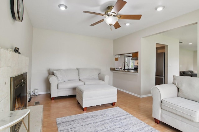104 S Walnut Ln, Schaumburg, IL 60193 - living area with ceiling fan, light wood finished floors, baseboards, a tile fireplace, and recessed lighting