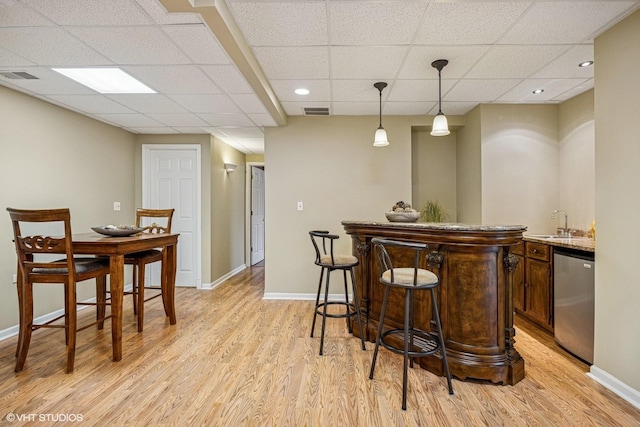 6 Valhalla Ct, Lake In The Hills, IL 60156 - indoor wet bar featuring stainless steel dishwasher, light wood finished floors, a paneled ceiling, baseboards, and recessed lighting