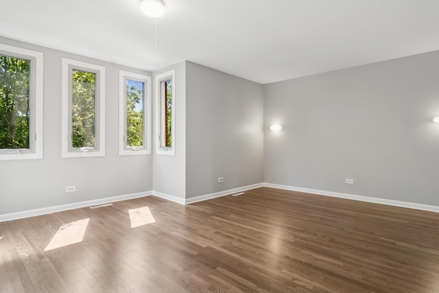 2717 S Michigan Ave, Chicago, IL 60616 - spare room featuring baseboards and wood finished floors