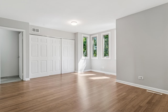 2717 S Michigan Ave, Chicago, IL 60616 - unfurnished bedroom featuring baseboards, wood finished floors, and a closet