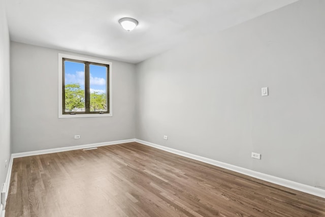 2717 S Michigan Ave, Chicago, IL 60616 - spare room with wood finished floors and baseboards