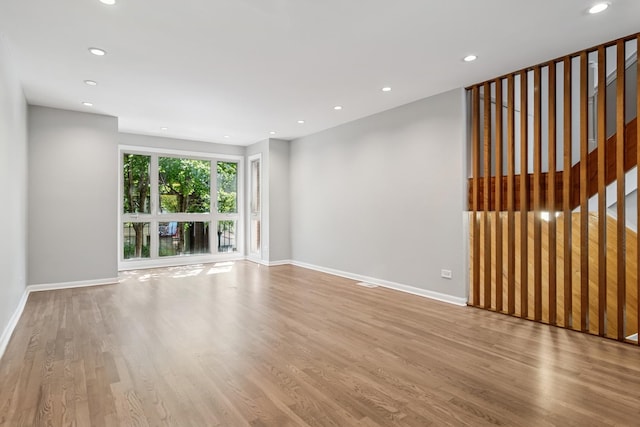 2717 S Michigan Ave, Chicago, IL 60616 - spare room featuring wood finished floors, baseboards, recessed lighting, and stairs