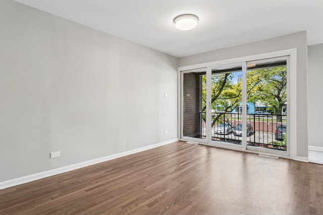 2717 S Michigan Ave, Chicago, IL 60616 - spare room featuring wood finished floors and baseboards