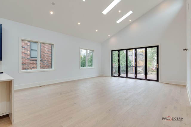 1649 Mount Pleasant St, Northfield, IL 60093 - empty room with high vaulted ceiling, light wood finished floors, recessed lighting, and baseboards