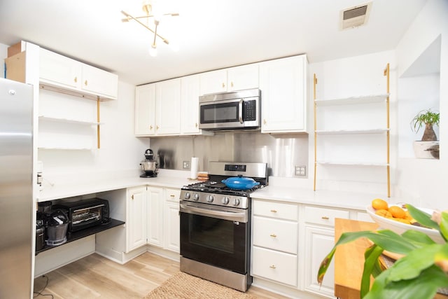 4336 N Kenmore Ave Unit G, Chicago, IL 60613 - kitchen with appliances with stainless steel finishes, open shelves, white cabinets, light wood-type flooring, and light countertops