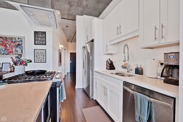 50 E 16th St Unit 312, Chicago, IL 60616 - kitchen with stainless steel appliances, a sink, dark wood-style flooring, white cabinetry, and backsplash
