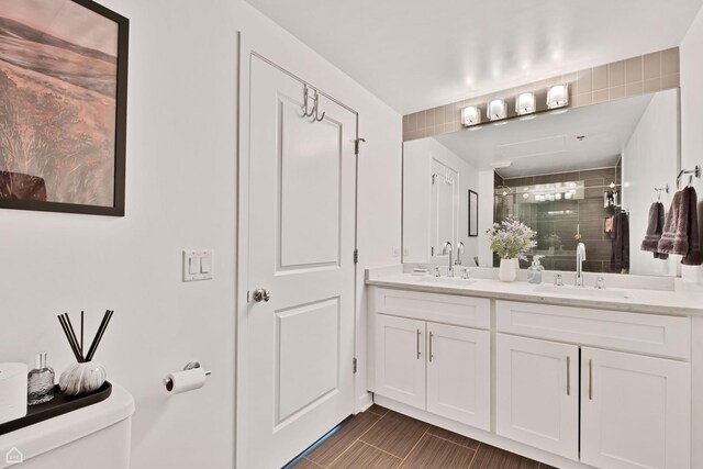 50 E 16th St Unit 312, Chicago, IL 60616 - bathroom with toilet, double vanity, and a shower stall