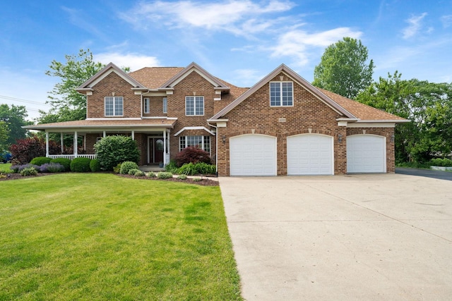 6099 Polo Club Dr, Yorkville, IL 60560 - view of front of property featuring a front lawn, driveway, a garage, and brick siding