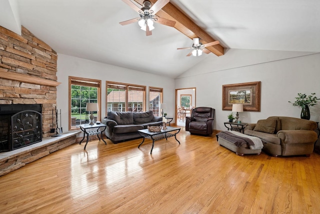 6099 Polo Club Dr, Yorkville, IL 60560 - living area with ceiling fan, beamed ceiling, light wood finished floors, a stone fireplace, and high vaulted ceiling