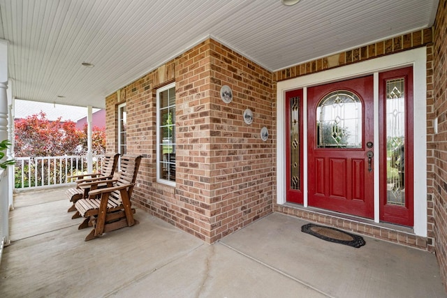 6099 Polo Club Dr, Yorkville, IL 60560 - view of exterior entry with covered porch and brick siding