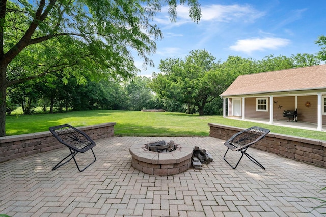 6099 Polo Club Dr, Yorkville, IL 60560 - view of patio / terrace with a fire pit, a grill, and view of wooded area
