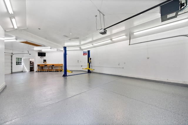 6099 Polo Club Dr, Yorkville, IL 60560 - garage with a garage door opener and baseboards