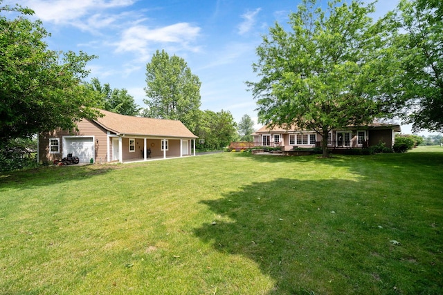 6099 Polo Club Dr, Yorkville, IL 60560 - view of green lawn with an attached garage