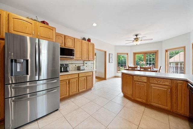 6099 Polo Club Dr, Yorkville, IL 60560 - kitchen featuring stainless steel refrigerator with ice dispenser, decorative backsplash, light countertops, ceiling fan, and light tile patterned floors