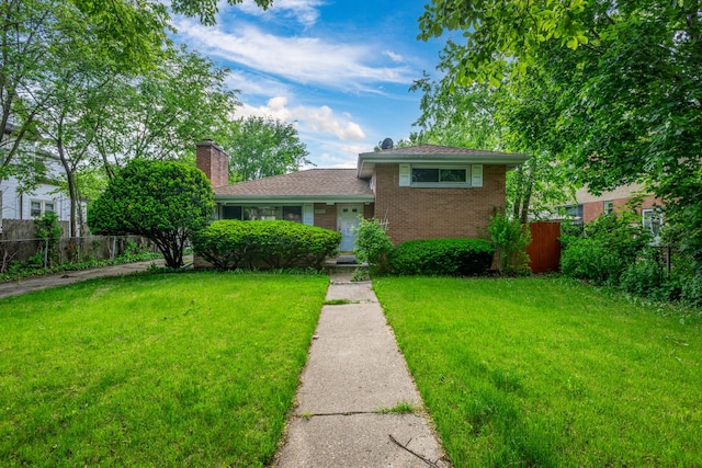 1808 Laurel Ave, Evanston, IL 60201 - split level home with a chimney and brick siding