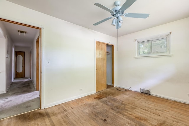 1808 Laurel Ave, Evanston, IL 60201 - unfurnished bedroom featuring baseboards, hardwood / wood-style floors, a closet, and ceiling fan