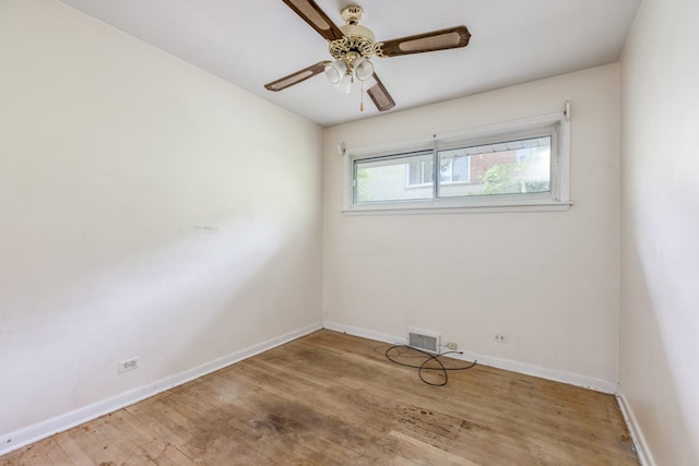 1808 Laurel Ave, Evanston, IL 60201 - spare room featuring baseboards, wood finished floors, and ceiling fan