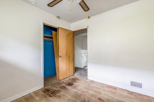 1808 Laurel Ave, Evanston, IL 60201 - unfurnished bedroom with baseboards, wood finished floors, a closet, and ceiling fan