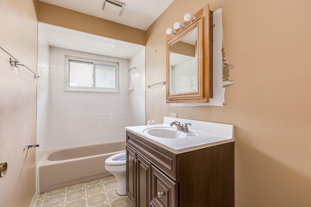 1808 Laurel Ave, Evanston, IL 60201 - bathroom featuring toilet, vanity, shower / washtub combination, and tile patterned flooring