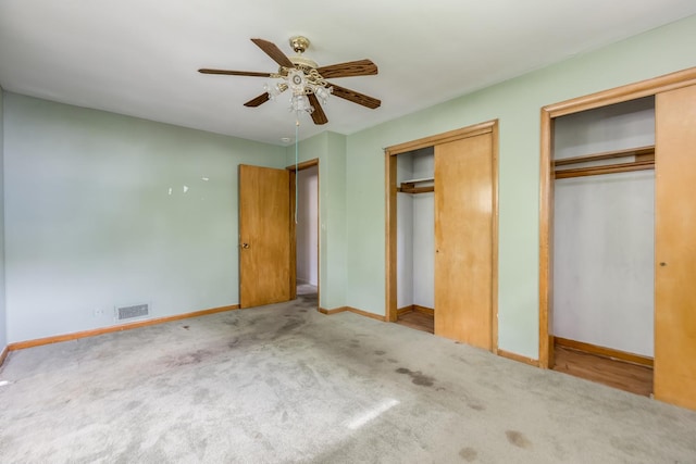 1808 Laurel Ave, Evanston, IL 60201 - unfurnished bedroom featuring multiple closets, baseboards, carpet flooring, and a ceiling fan