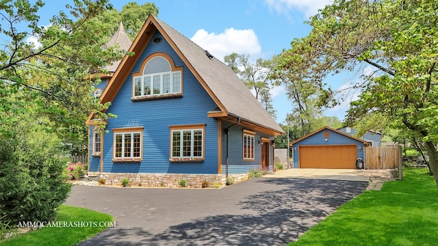 1616 Riverside Ave, Saint Charles, IL 60174 - view of front of home featuring an outdoor structure, a garage, and roof with shingles