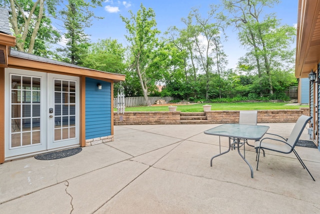 1616 Riverside Ave, Saint Charles, IL 60174 - fenced backyard featuring french doors, a patio area, and outdoor dining area
