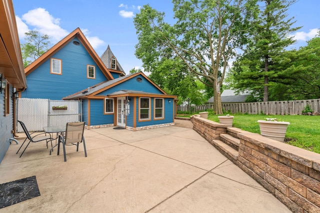 1616 Riverside Ave, Saint Charles, IL 60174 - rear view of property with a patio, a fenced backyard, an outbuilding, and outdoor dining area