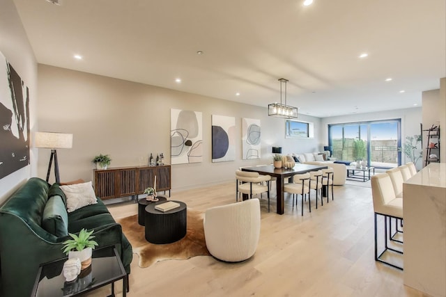 613 N Ogden Ave Unit 4W, Chicago, IL 60642 - living area with light wood-style flooring and recessed lighting