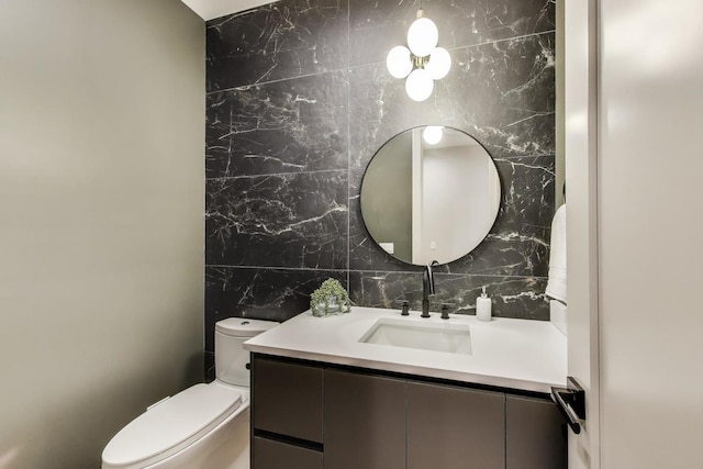 613 N Ogden Ave Unit 4W, Chicago, IL 60642 - bathroom featuring vanity, tile walls, and backsplash