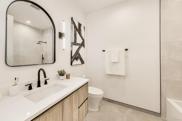 613 N Ogden Ave Unit 4W, Chicago, IL 60642 - full bath with vanity, tile patterned floors, and washtub / shower combination