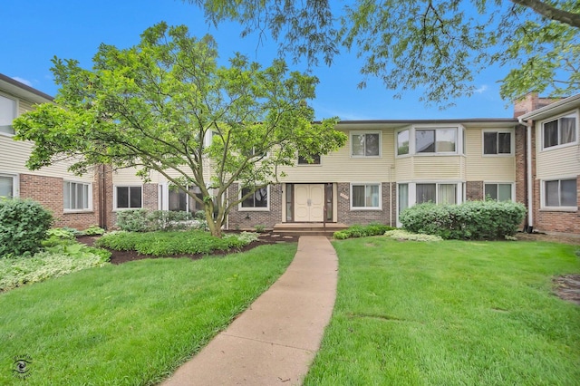 3030 Roberts Dr Unit 4, Woodridge, IL 60517 - view of property featuring brick siding and a front yard