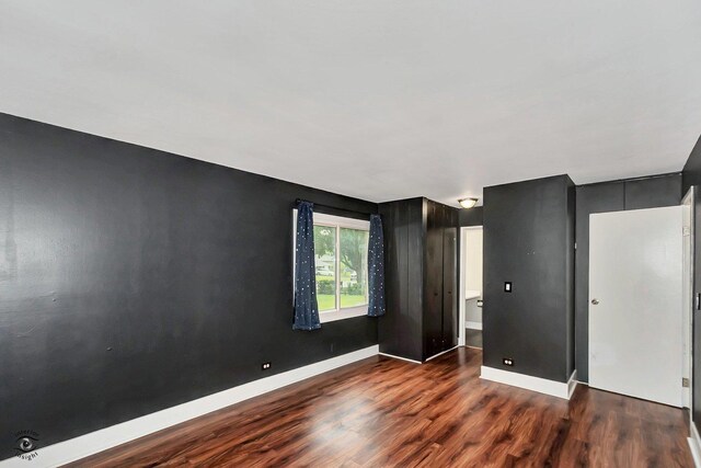 3030 Roberts Dr Unit 4, Woodridge, IL 60517 - unfurnished bedroom featuring wood finished floors and baseboards