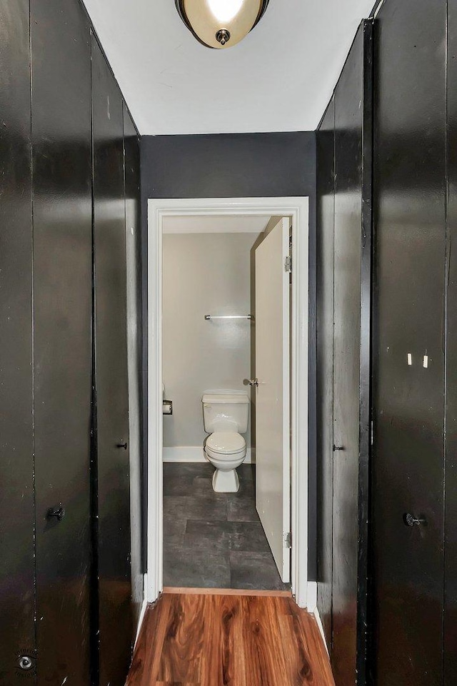 3030 Roberts Dr Unit 4, Woodridge, IL 60517 - bathroom with toilet, baseboards, and wood finished floors
