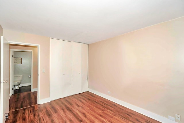 3030 Roberts Dr Unit 4, Woodridge, IL 60517 - unfurnished bedroom featuring wood finished floors, baseboards, and a closet