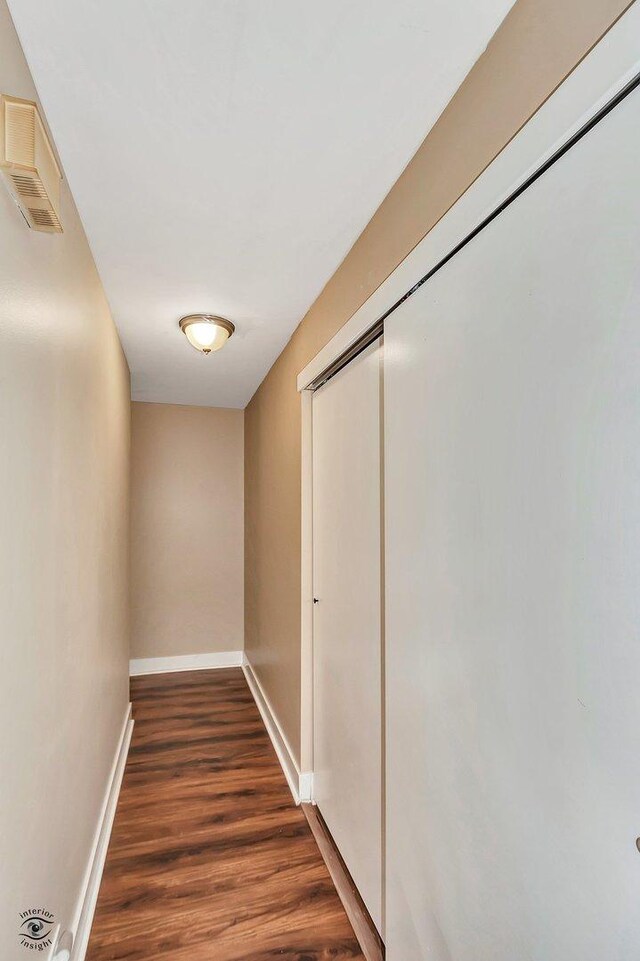 3030 Roberts Dr Unit 4, Woodridge, IL 60517 - hall featuring dark wood-type flooring and baseboards