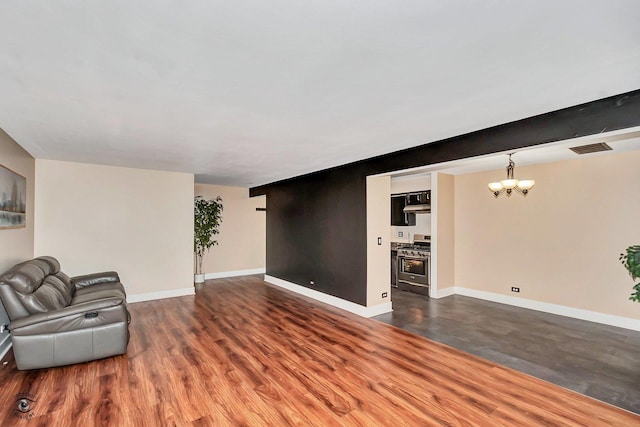 3030 Roberts Dr Unit 4, Woodridge, IL 60517 - unfurnished room with a chandelier, dark wood-style flooring, and baseboards