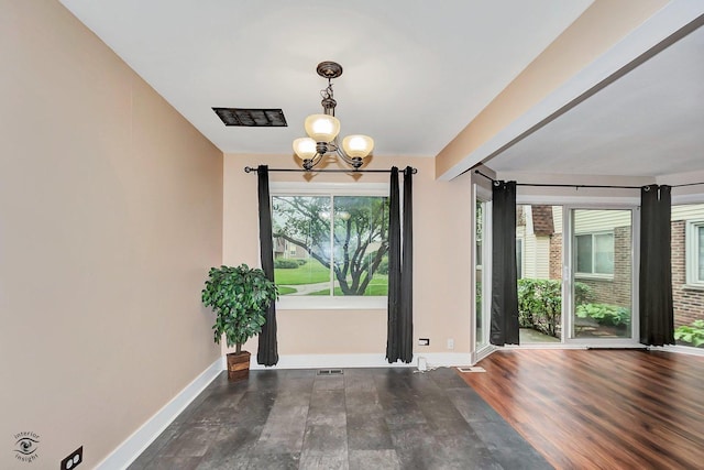 3030 Roberts Dr Unit 4, Woodridge, IL 60517 - unfurnished dining area featuring a chandelier, wood finished floors, and baseboards