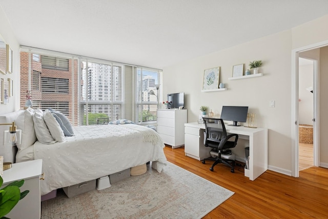 1400 N State Pkwy Unit 9F, Chicago, IL 60610 - bedroom with light wood finished floors and a desk