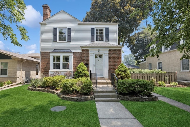 8335 Kostner Ave, Skokie, IL 60076 - traditional-style home with a chimney and brick siding