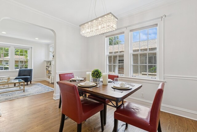 8335 Kostner Ave, Skokie, IL 60076 - dining space with ornamental molding, plenty of natural light, wood finished floors, arched walkways, and recessed lighting