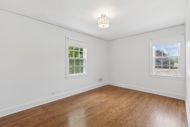 8335 Kostner Ave, Skokie, IL 60076 - spare room with hardwood / wood-style floors and baseboards