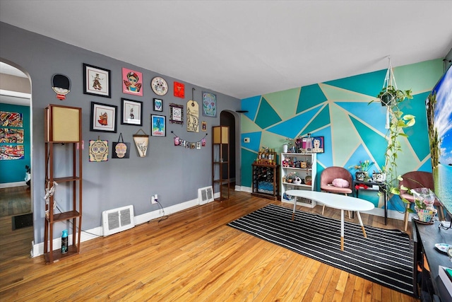 475 S Edison Ave, Elgin, IL 60123 - playroom featuring arched walkways, hardwood / wood-style flooring, and an accent wall