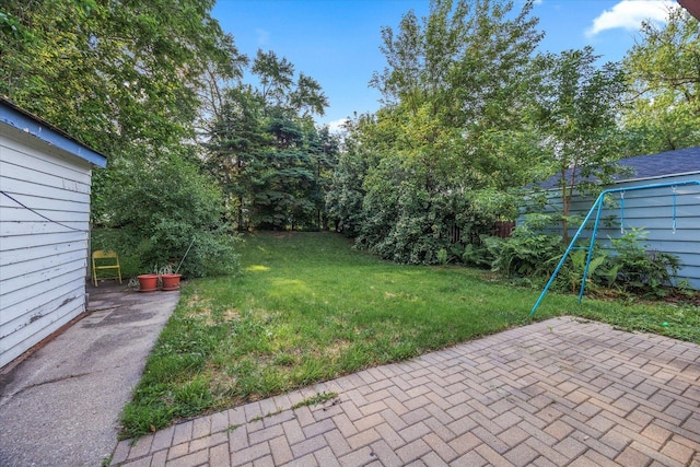 475 S Edison Ave, Elgin, IL 60123 - view of grassy yard featuring a patio