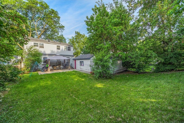 475 S Edison Ave, Elgin, IL 60123 - view of grassy yard featuring a gazebo, a patio, and an outbuilding