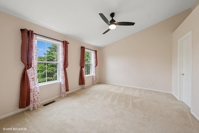 2746 Middleton Ct, Aurora, IL 60503 - empty room featuring lofted ceiling, light carpet, baseboards, and a ceiling fan